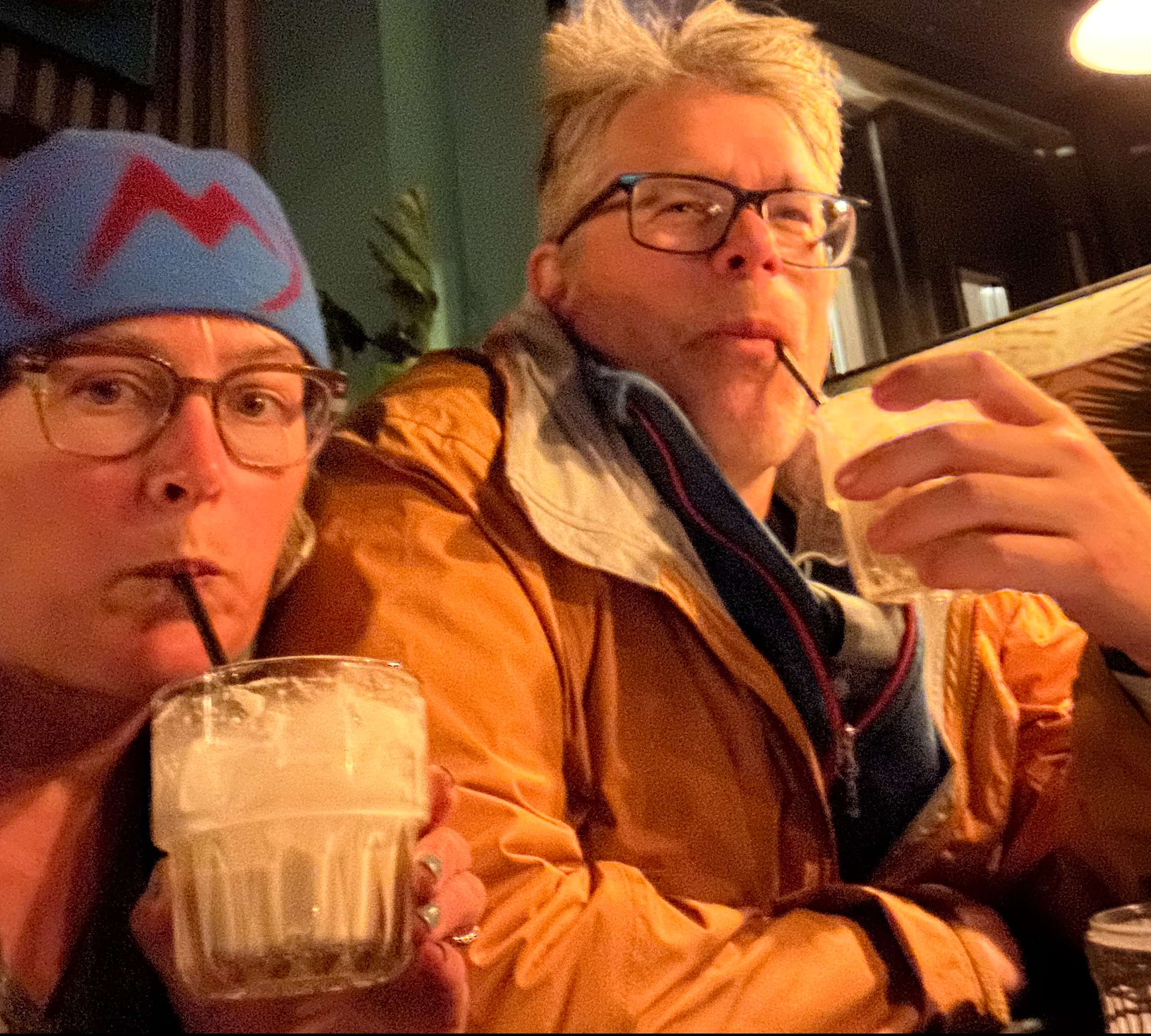 A woman and a ma drinking White Russians at Lebowski Bar, Reykjavik