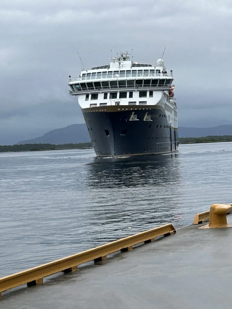 A ship enters a harbor.