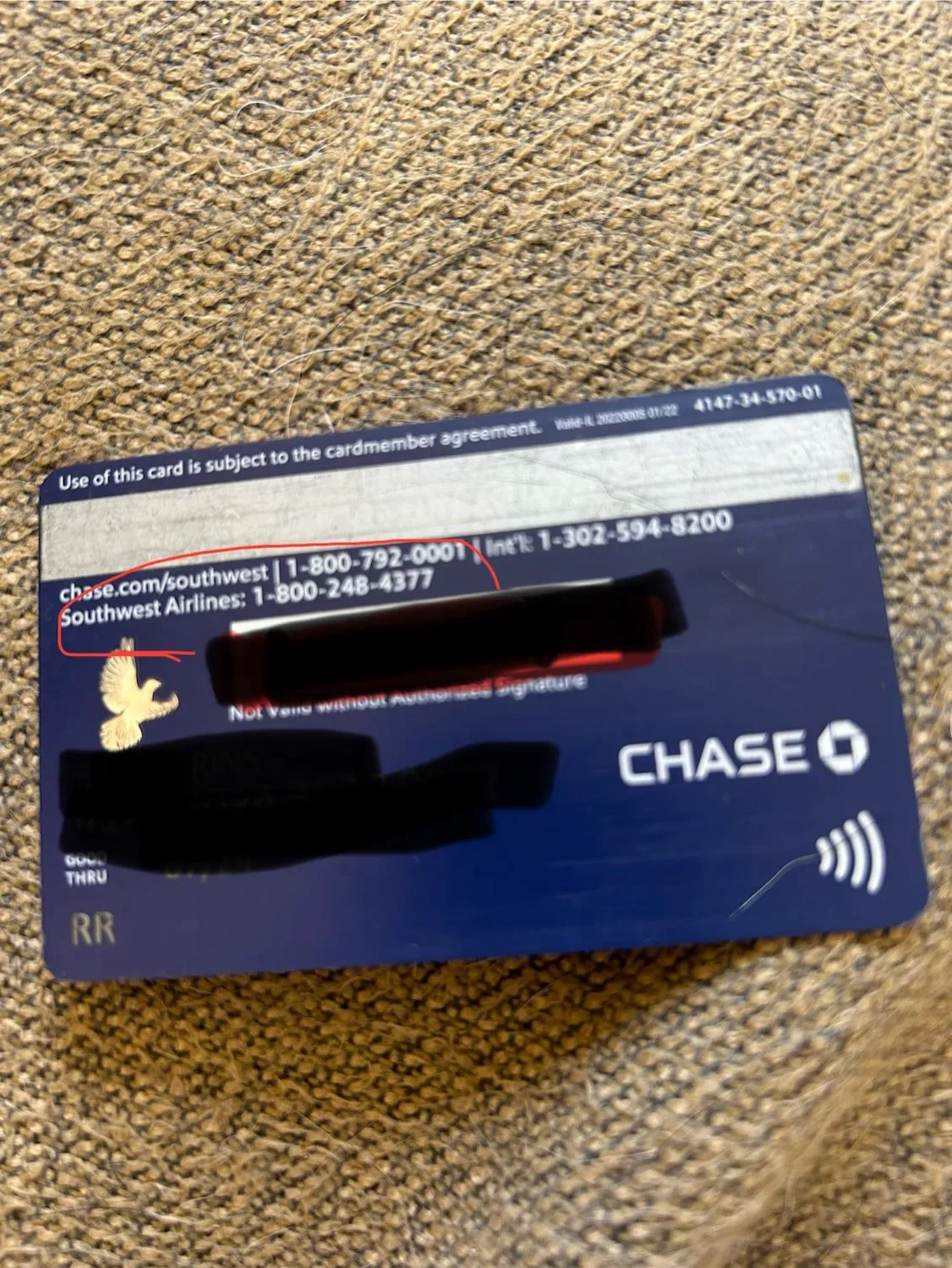 credit card with a customer service number printed on the back