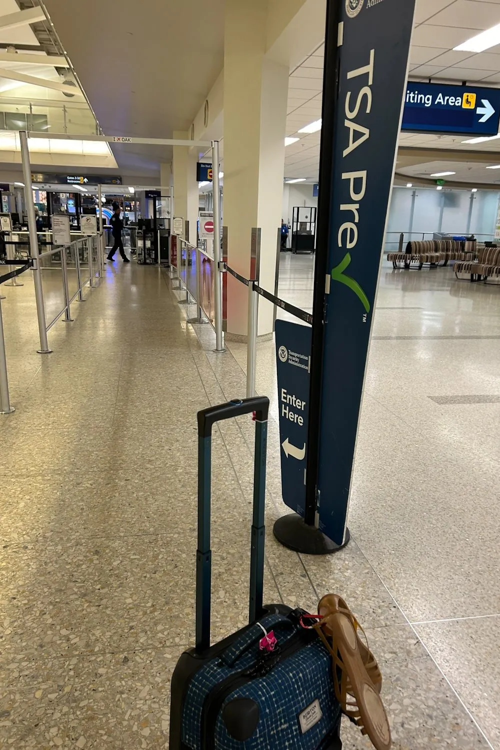 a suitcase in front of the TSA Precheck line, Oakland Airport
