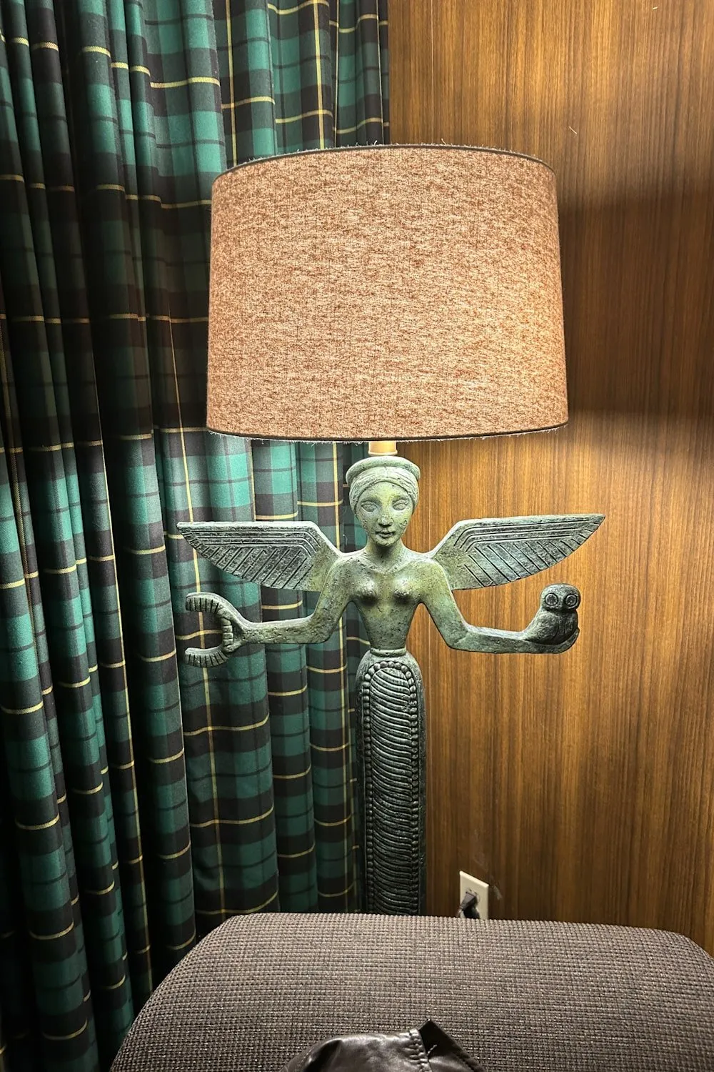 A lamp shaped like the goddess Athena holding an owl